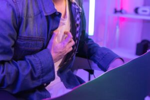 Man at party experiencing cardiovascular discomfort after consuming alcohol