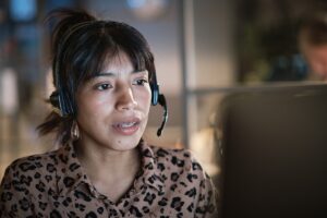Woman talking to caller via national hotline operated by Alcohol Awareness
