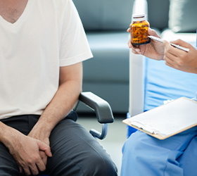 a person in an alcoholism recovery session