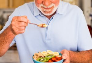 Sober and mature man eating balanced diet to help prevent Wernicke-Korsakoff Syndrome